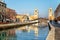 Venice, Italy - December 20, 2015: Picturesque view of arsenale, gate and canal in the sunny day in Venice.