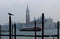 Venice, Italy, December 28, 2018 Dome of the Basilica of San Giorgio on the background with a seagull perched on a lamppost in the