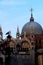 Venice, Italy, December 28, 2018 Dome of the Basilica of San Marco on the background with a seagull perched on a lamppost in the f