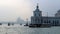 Venice, Italy, December 28, 2018 ferry moving in a canal with basilica in the background