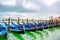 Venice, Italy. Empty docked gondolas/ gondole/ gondola boats floating on the river canal