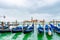 Venice, Italy. Empty Gondolas docked by lagoon mooring poles