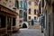 VENICE, ITALY - February 18, 2020: Beautiful woman wearing carnival costume  walking in romantic streets of Venice