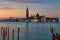 VENICE, ITALY - February 18, 2020: Colorful sunrise at the Giudecca Canal to the island of San Georgio Maggiore, with its campanil