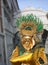 Venice, Italy - February 5, 2018: person with golden mask