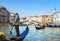 Venice, Italy. Gondolier with rowing oar in his gondola on Grand