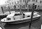 Venice, Italy, January 27, 2020 ambulance first aid motorboats moored in the docking point with wooden poles