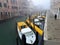 Venice, Italy, January 27, 2020 ambulance first aid motorboats moored in the docking point with wooden poles