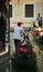 VENICE, ITALY - JULY 12 : Gondolier plying his trade in Venice Italy