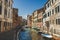 Venice, Italy - July 14th, 2017.Venice cityscape, narrow water canal, bridge and traditional buildings. Italy