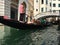 Venice, Italy - July 3, 2018: gondoliers conduct tours of the historical sites a