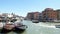VENICE, ITALY - JULY 7, 2018: On main Venice canal, floating, many different boats, vaparetto, motor ships. At the wharf