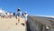 VENICE, ITALY - JULY 7, 2018: Rialto bridge and The Grand Canal , tourists, a young woman in a hat and shorts with a