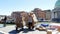 VENICE, ITALY - JULY 7, 2018: workers unload package delivery boat , full of boxes, parcels. The postal boat delivers