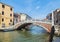 VENICE, ITALY - JUNE 15, 2016 View of Ponte delle Guglie Bridge of Spires over Canaregio Canal on sunny day