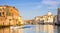 Venice, Italy - June 28, 2014: Cityscape of Venice - motorboat sailing on Grand Canal past colorful buildings