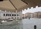 Venice, Italy - June 30, 2017: A view of the colorful Venetian houses, Gondola and boats in a canal. made from under a