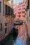 VENICE, ITALY - March 24, 2019: Gandola with tourists on the channel in Venice
