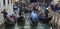Venice, Italy - May 1, 2017: Gondolas are congested, yet try to work together to keep traffic flowing