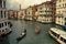 Venice Italy. May 15, 2018. Tourists strolling quietly through the canals of Venice during a stormy day