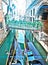 Venice. Italy. Narrow street the channel with the bridge and gondolas