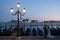 VENICE, ITALY - OCTOBER 7 , 2017: bride and groom on Piazza San Marco, gondolas on the background