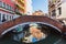 VENICE, ITALY - OKTOBER 27, 2016: colorful corners with old classic buildings, small bridge and little water canal in Venice,