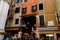 Venice, Italy panorama on a beautiful day with small narrow streets, canals and boats and gondolas floating under bridges.