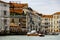 Venice, Italy panorama on a beautiful day with small narrow streets, canals and boats and gondolas floating under bridges.