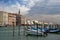 Venice, Italy. Parked motor boat and gondolas in a row