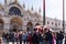 Venice, Italy Saint Mark square with crowd during carnival. Basilica di San Marco facade with people at Piazza