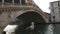 Venice, Italy a seagull standing under Rialto Bridge.