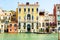 Venice, Italy - September 07, 2017: Gondolier sails past of Venetian houses. Colorful life of Venice