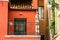 Venice, Italy - September 07, 2017: A picturesque Venetian house with a statue of a little angel. Red house, Venice, details.