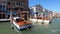 Venice, Italy - September 9, 2019: view from Grand Canal on berth with river buses and people near houses in Venice, Italy