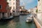 Venice, Italy, Tourists walk on the embankment of the canal opposite San Trovaso