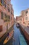 Venice, italy: traditional venice canal scene. gondola and blue sky