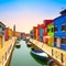 Venice landmark, Burano island canal, colorful houses and boats, Italy