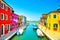 Venice landmark, Burano island canal, colorful houses and boats, Italy