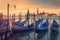 Venice landscape with gondolas at sunset, Italy. Beautiful view on San Giorgio di Maggiore church in Venice