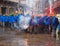 Venice, March 03 2015: anti capitalist demonstrators on the streets in venice with masks and flares with smoke