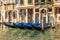 Venice palace with gondolas moored, Grand Canal, Italy