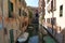 Venice panorama: canal, boats and old brick houses in Venice, Italy, Europe