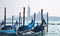 Venice Panorama with nice gondolas. Panoramic cityscape image of Venice, Italy and waterfront of Saint Mark square and San Giorgio