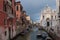 Venice, Piazza with a marble fasade of the cathedral, the canal and boat