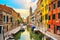 Venice rio San Barnaba cityscape, water canal, church and boats.