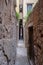 Venice`s narrowest street, brick walls and arched passage