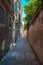 Venice`s narrowest street between brick walls, Italy