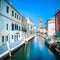 Venice San Barnaba cityscape, water canal, church and boats. Italy