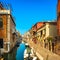 Venice San Barnaba cityscape, water canal, church and boats. Italy